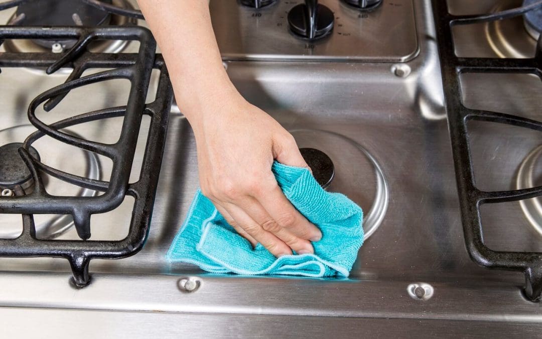 scrub your stove while spring cleaning
